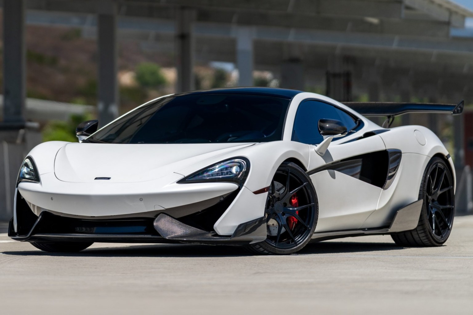 White 2019 McLaren 570GT photographed from the front three-quarter view