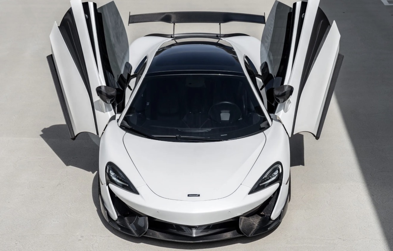 White 2019 McLaren 570GT with its dihedral doors open